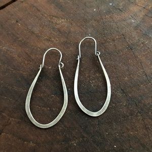 Hand forged sterling silver earrings.